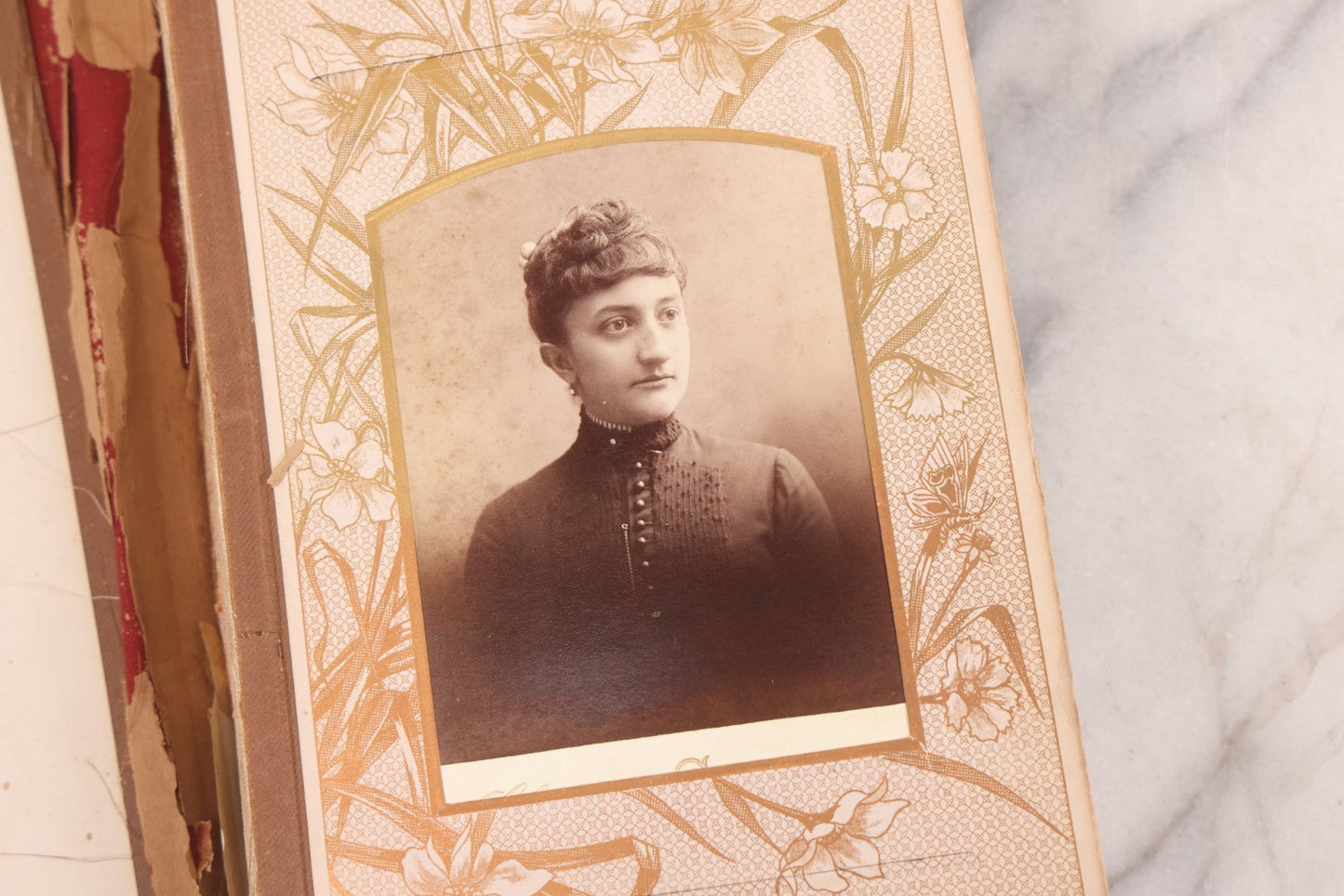 Lot 087 - Antique Cabinet Card Photo Album With Pressed Metal Cover, Floral Design, Raised Decorative Metal Album Lettering, Red Fabric Back Cover, Containing 58 Cabinet Card Photos Including Boy with Bicycle, Knights Templar, and Woman in Mourning