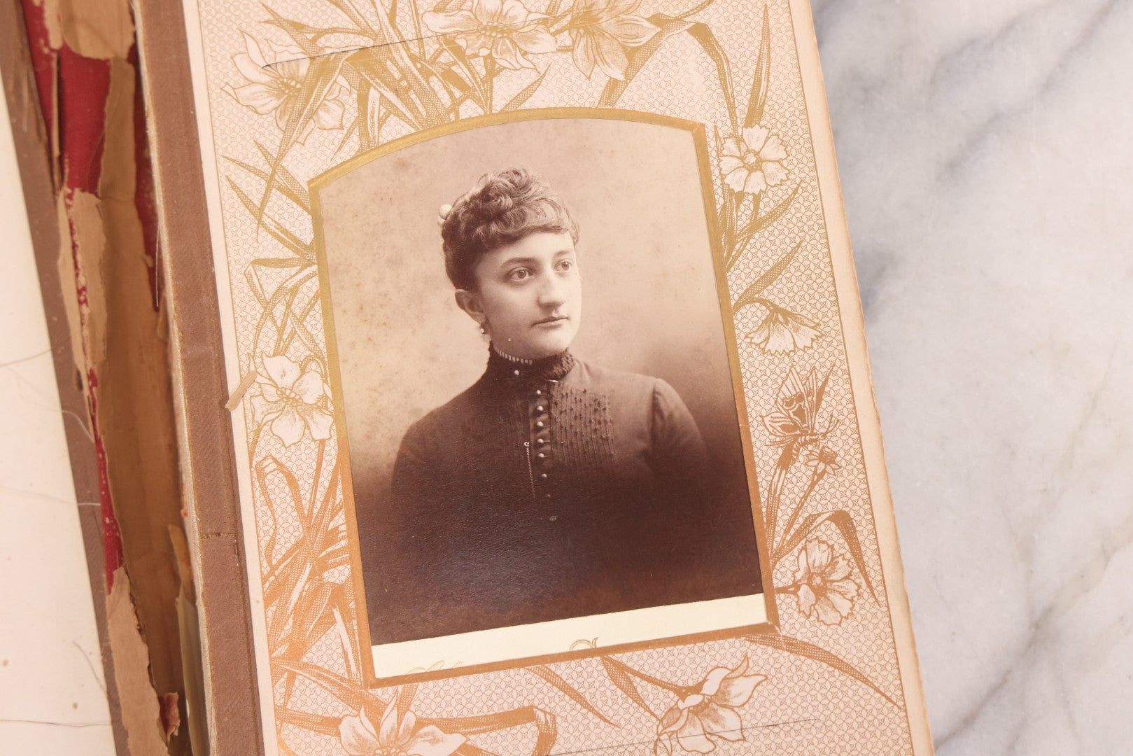 Lot 087 - Antique Cabinet Card Photo Album With Pressed Metal Cover, Floral Design, Raised Decorative Metal Album Lettering, Red Fabric Back Cover, Containing 58 Cabinet Card Photos Including Boy with Bicycle, Knights Templar, and Woman in Mourning