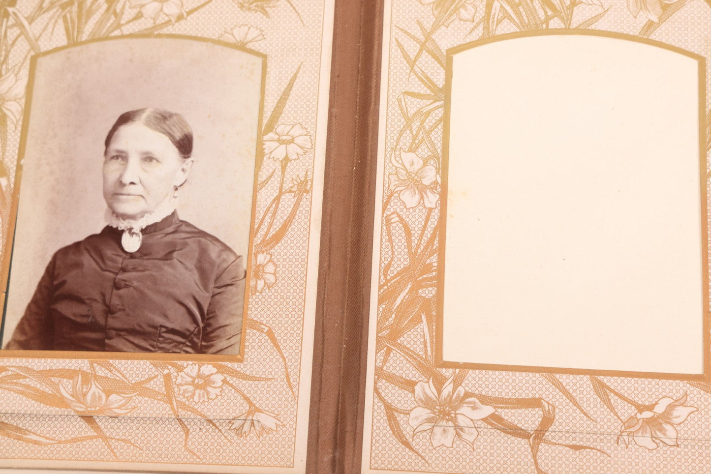 Lot 087 - Antique Cabinet Card Photo Album With Pressed Metal Cover, Floral Design, Raised Decorative Metal Album Lettering, Red Fabric Back Cover, Containing 58 Cabinet Card Photos Including Boy with Bicycle, Knights Templar, and Woman in Mourning