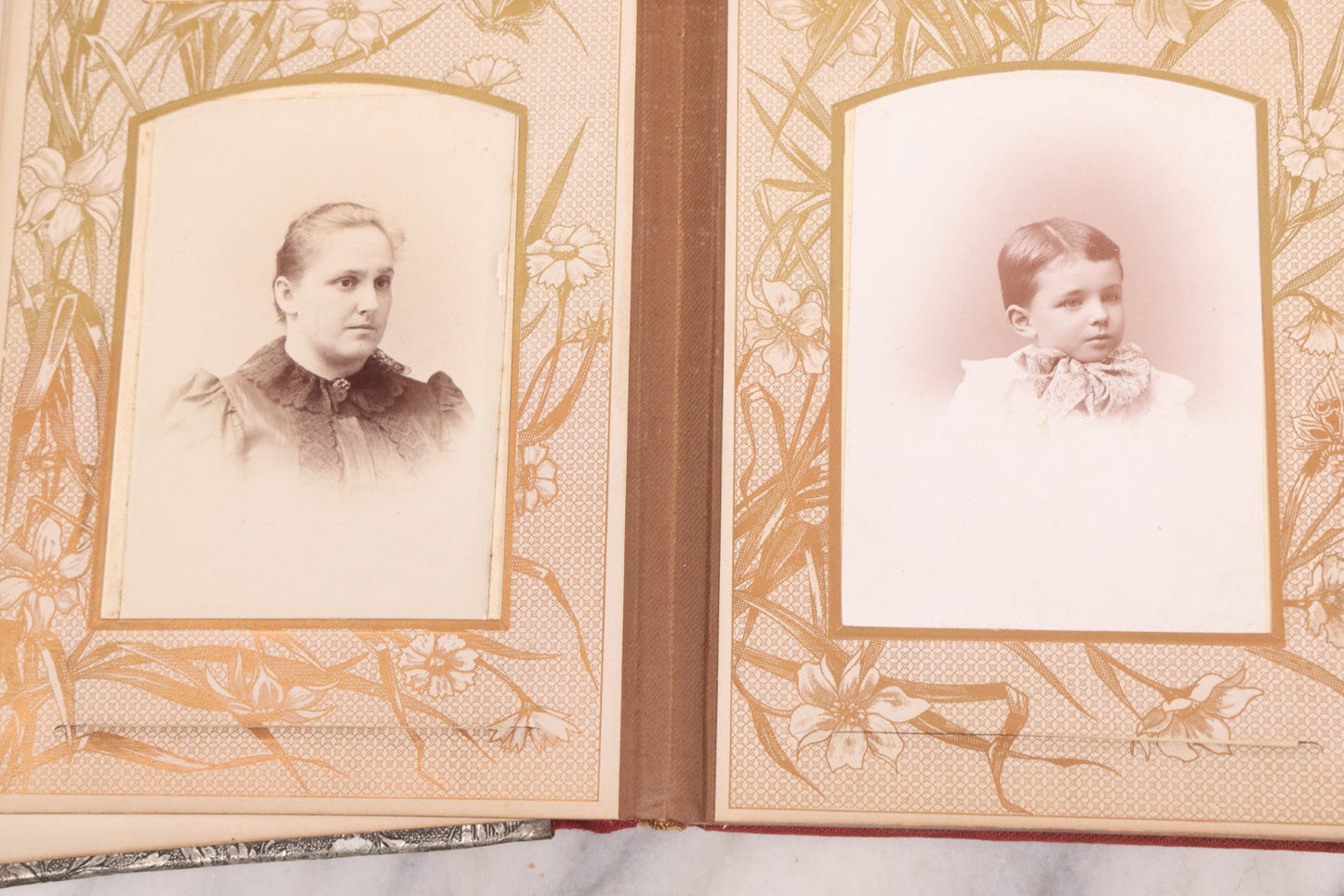 Lot 087 - Antique Cabinet Card Photo Album With Pressed Metal Cover, Floral Design, Raised Decorative Metal Album Lettering, Red Fabric Back Cover, Containing 58 Cabinet Card Photos Including Boy with Bicycle, Knights Templar, and Woman in Mourning