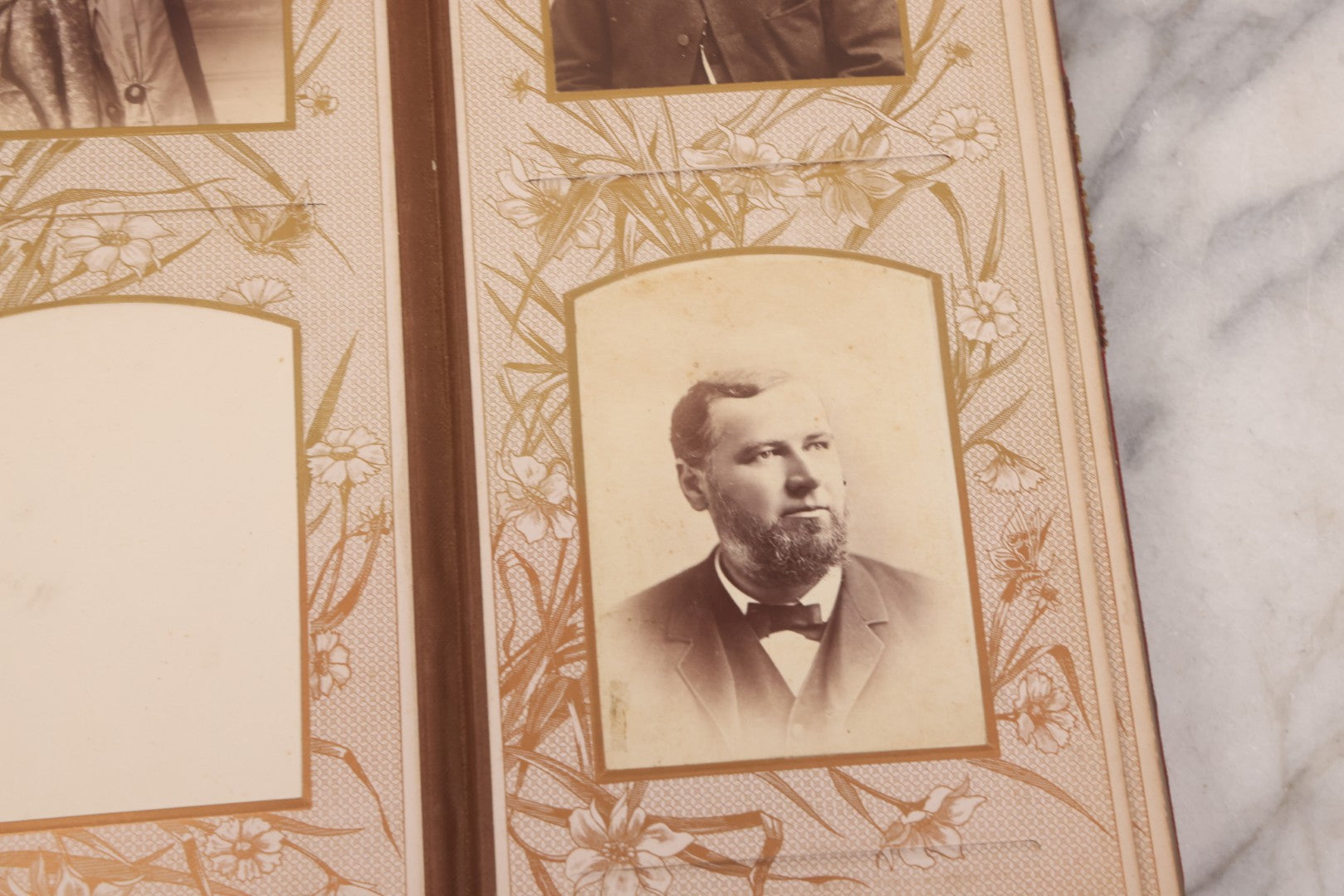 Lot 087 - Antique Cabinet Card Photo Album With Pressed Metal Cover, Floral Design, Raised Decorative Metal Album Lettering, Red Fabric Back Cover, Containing 58 Cabinet Card Photos Including Boy with Bicycle, Knights Templar, and Woman in Mourning