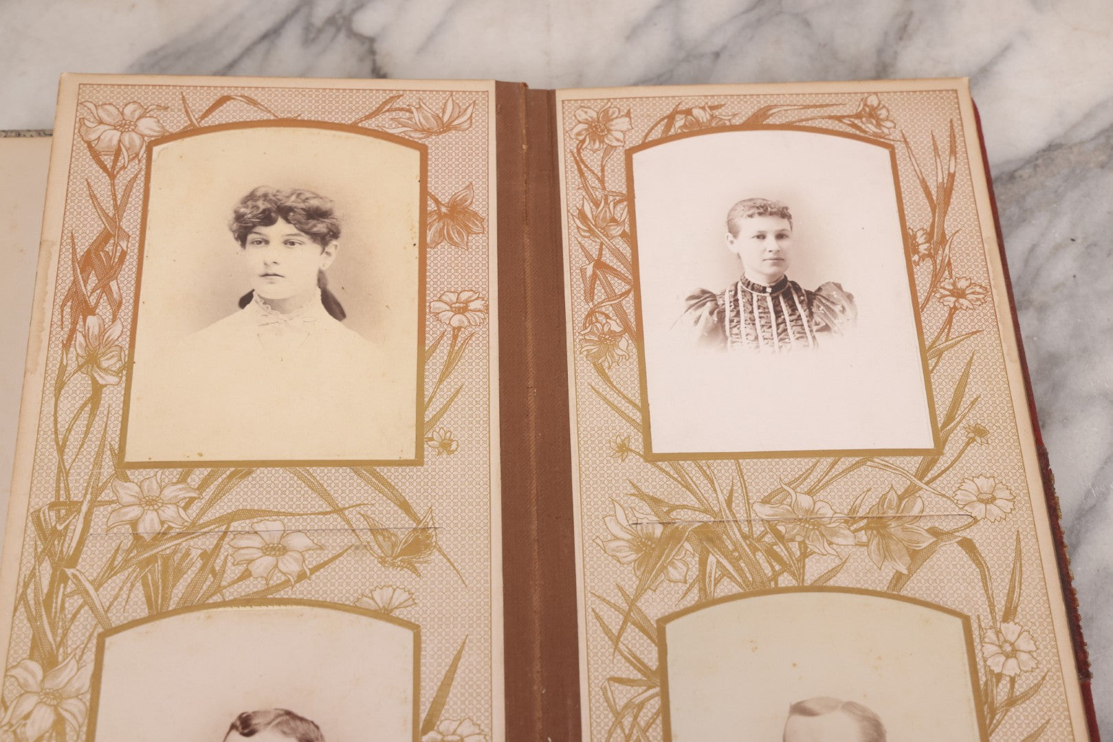Lot 087 - Antique Cabinet Card Photo Album With Pressed Metal Cover, Floral Design, Raised Decorative Metal Album Lettering, Red Fabric Back Cover, Containing 58 Cabinet Card Photos Including Boy with Bicycle, Knights Templar, and Woman in Mourning
