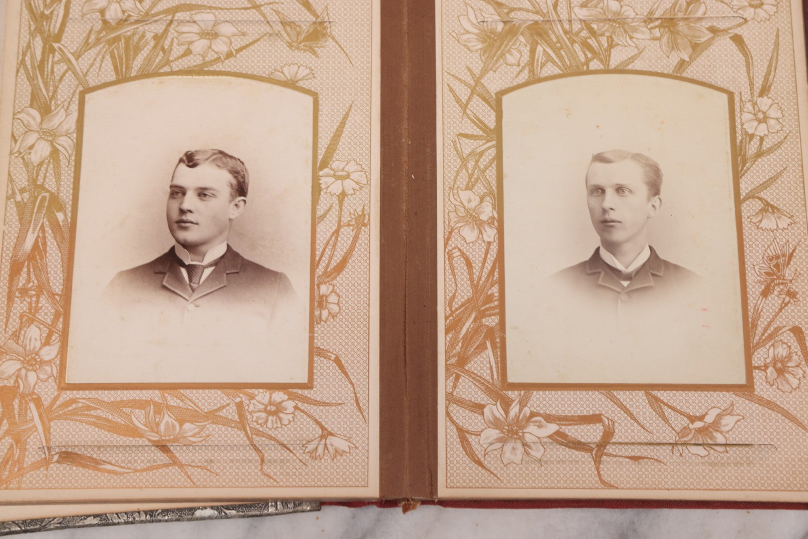 Lot 087 - Antique Cabinet Card Photo Album With Pressed Metal Cover, Floral Design, Raised Decorative Metal Album Lettering, Red Fabric Back Cover, Containing 58 Cabinet Card Photos Including Boy with Bicycle, Knights Templar, and Woman in Mourning