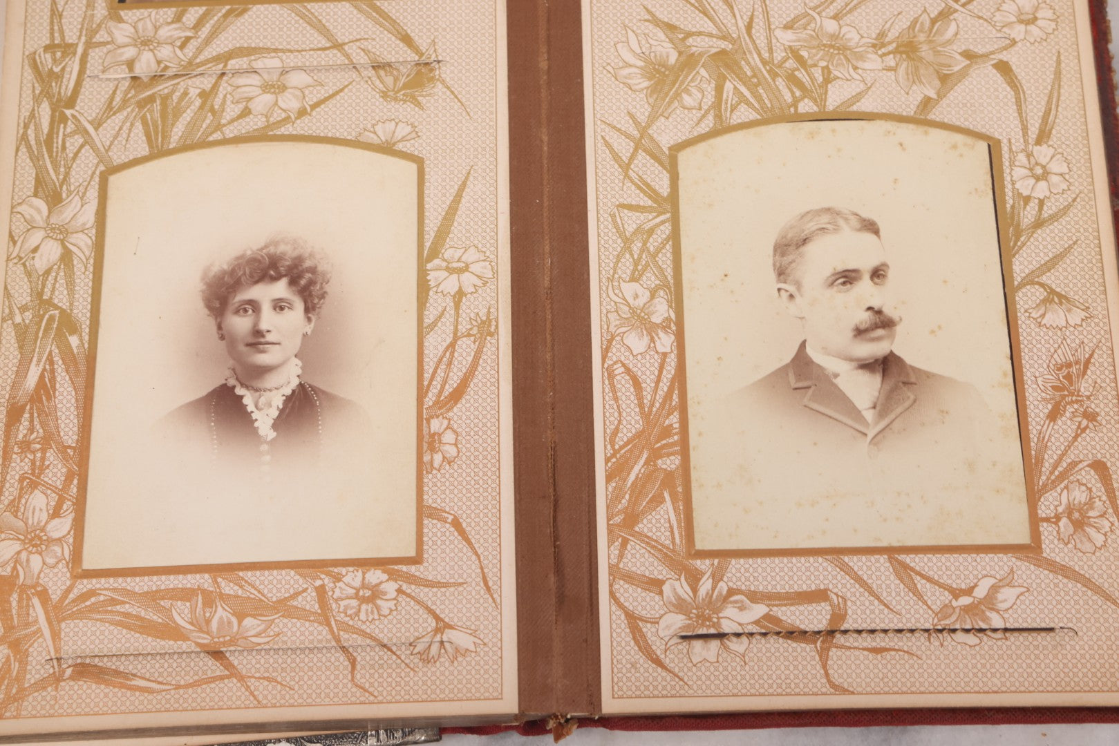 Lot 087 - Antique Cabinet Card Photo Album With Pressed Metal Cover, Floral Design, Raised Decorative Metal Album Lettering, Red Fabric Back Cover, Containing 58 Cabinet Card Photos Including Boy with Bicycle, Knights Templar, and Woman in Mourning