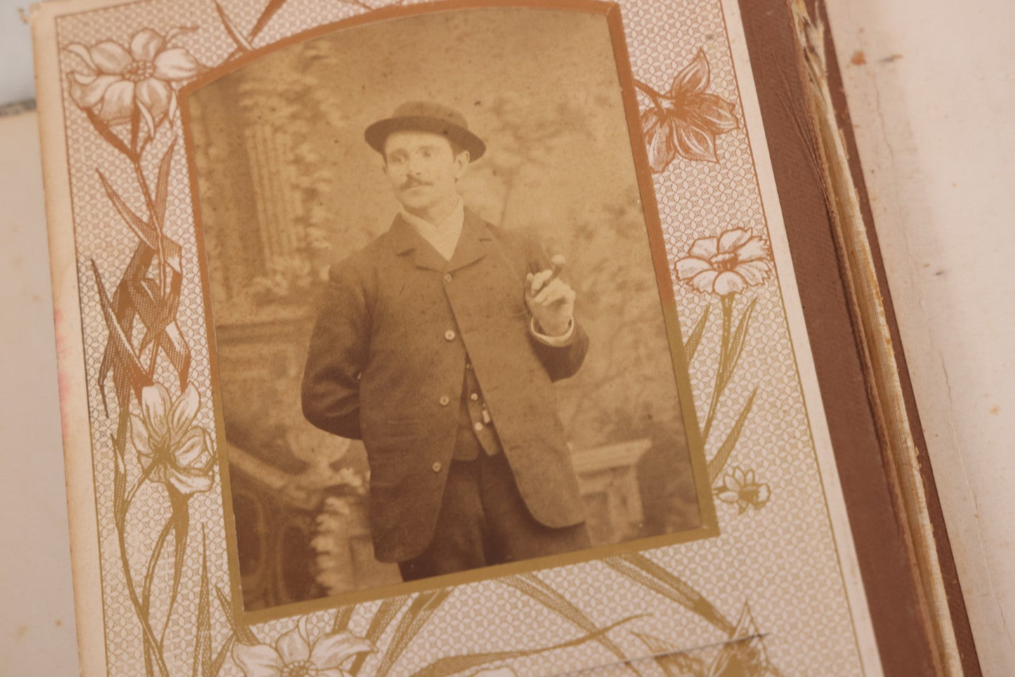 Lot 087 - Antique Cabinet Card Photo Album With Pressed Metal Cover, Floral Design, Raised Decorative Metal Album Lettering, Red Fabric Back Cover, Containing 58 Cabinet Card Photos Including Boy with Bicycle, Knights Templar, and Woman in Mourning