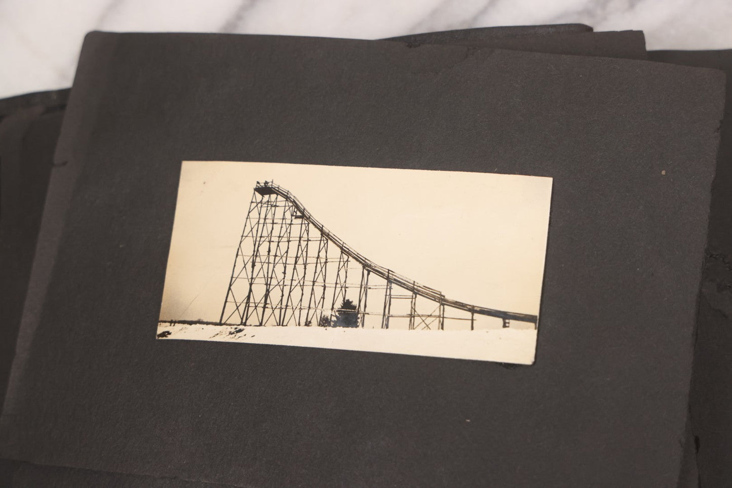 Lot 088 - Vintage Snapshot Photo Album Containing 16 Trimmed Photos Including Photos Of Giant Ski Jump And Mountain Cabin
