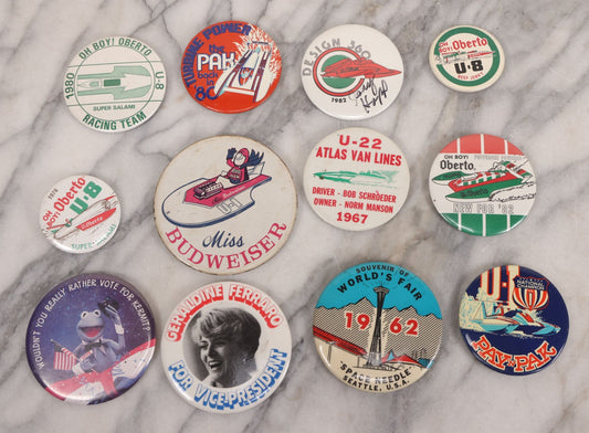 Lot 094 - Vintage Grouping Of 12 Buttons, Including Signed Jerry Hopp Button, "Super Salami" Racing Buttons, Vote For Kermit Button, Others