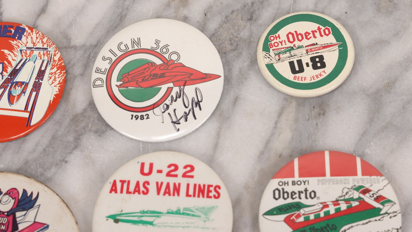 Lot 094 - Vintage Grouping Of 12 Buttons, Including Signed Jerry Hopp Button, "Super Salami" Racing Buttons, Vote For Kermit Button, Others