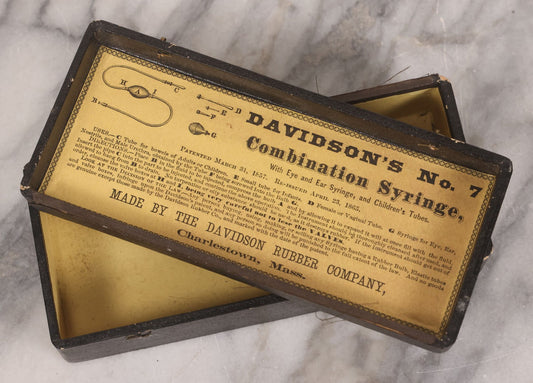 Lot 097 - Antique Medical Syringe Box For Davidson's No. 7 Combination Syringe, With Paper Label On Interior Lid, Patented 1857, Re-Issued 1865, Made By The Davidson Rubber Company, Charlestown, Massachusetts, Note Empty, Cover Detached