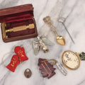 Lot 100 - Vintage Eight Piece Mixed Smalls Grouping Including Metal Eagle Finial, Gillette Razor In Case, Hollywood Farmers Market Pocket Knife With Keychain, Miniature Mittens, Plastic French Cameo Brooch, And More