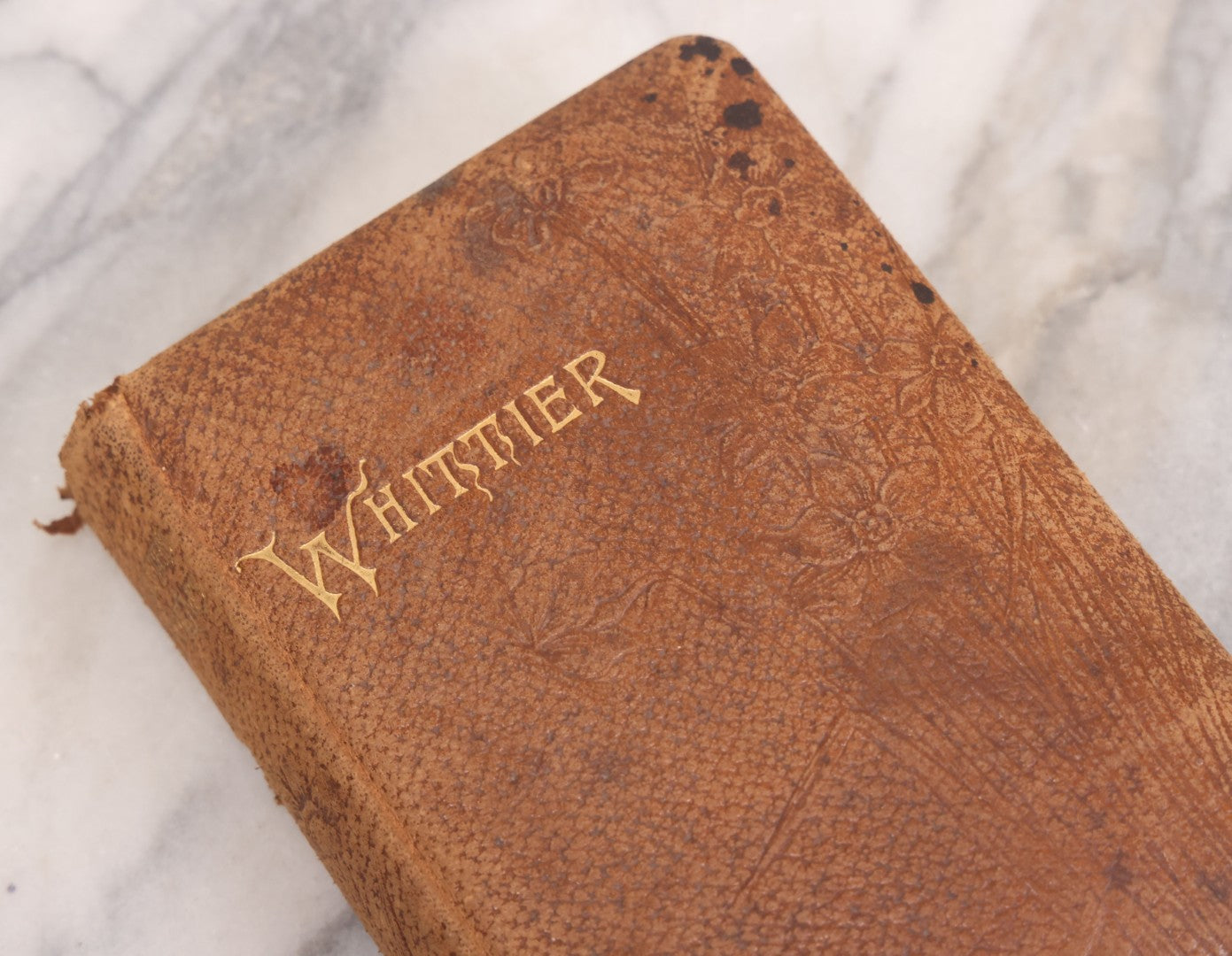 Lot 108 - Whittier's Poems Antique Poetry Book With Leather Cover, Gold Embossed Lettering And Embossed Flower Design On Covers And Spine, With Engraved Portrait Of Whittier Frontispiece, Red And Gold Fore Edge, Hurst And Company, Publishers, New York