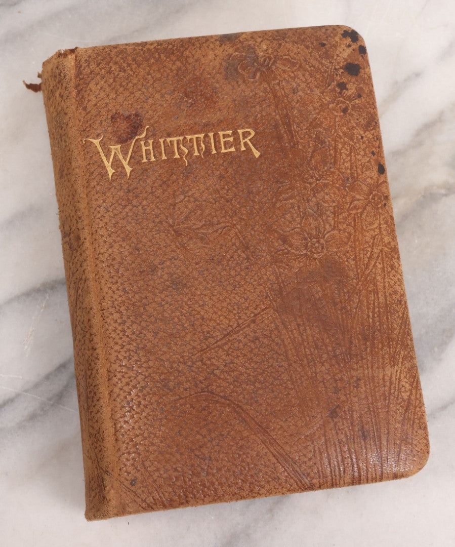 Lot 108 - Whittier's Poems Antique Poetry Book With Leather Cover, Gold Embossed Lettering And Embossed Flower Design On Covers And Spine, With Engraved Portrait Of Whittier Frontispiece, Red And Gold Fore Edge, Hurst And Company, Publishers, New York