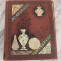 Lot 114 - Antique Victorian Scrapbook Album With Textured Urns On Cover Containing 70+ Pieces Including Trade Cards, Die Cuts, Calling Cards, And Other Scraps