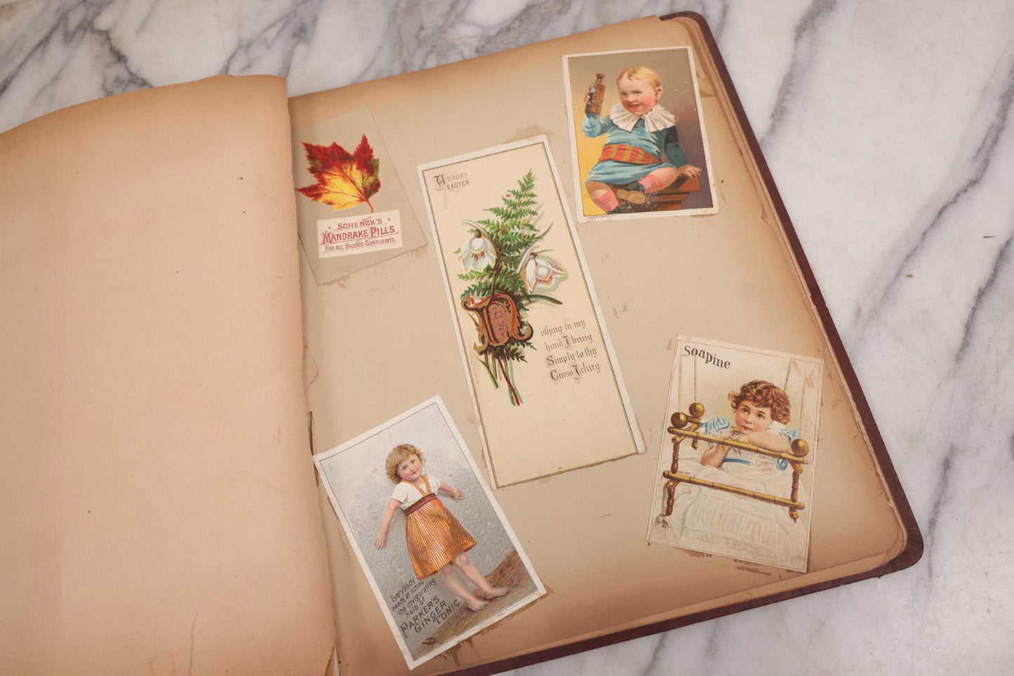 Lot 115 - Antique Victorian Scrapbook Album With Children, Flowers, Foliage On Cover Containing 50+ Pieces Including Trade Cards, Die Cuts, Calling Cards, And Other Scraps