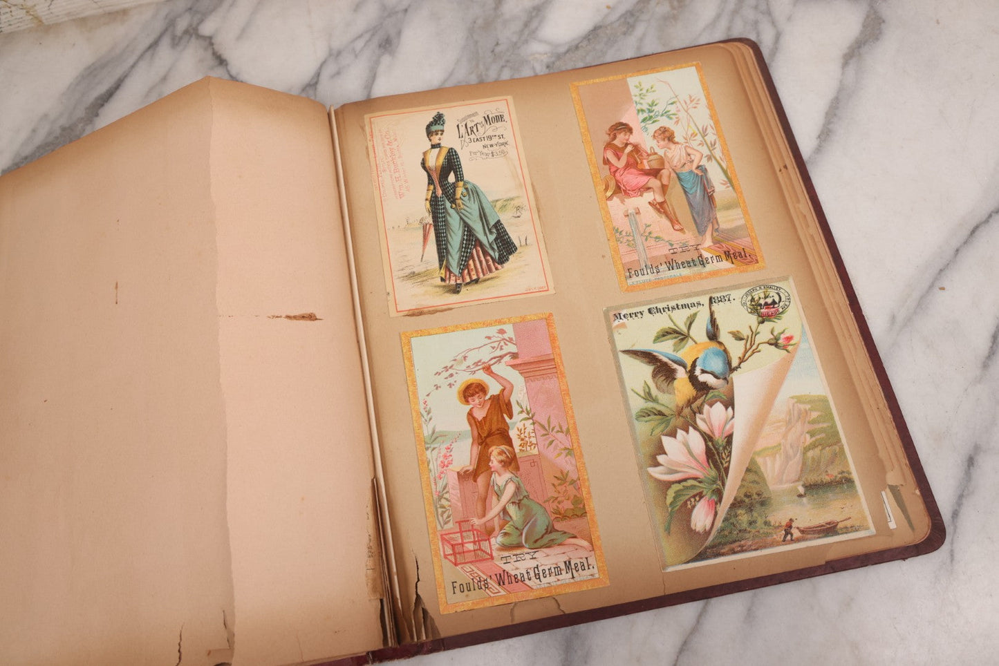 Lot 115 - Antique Victorian Scrapbook Album With Children, Flowers, Foliage On Cover Containing 50+ Pieces Including Trade Cards, Die Cuts, Calling Cards, And Other Scraps