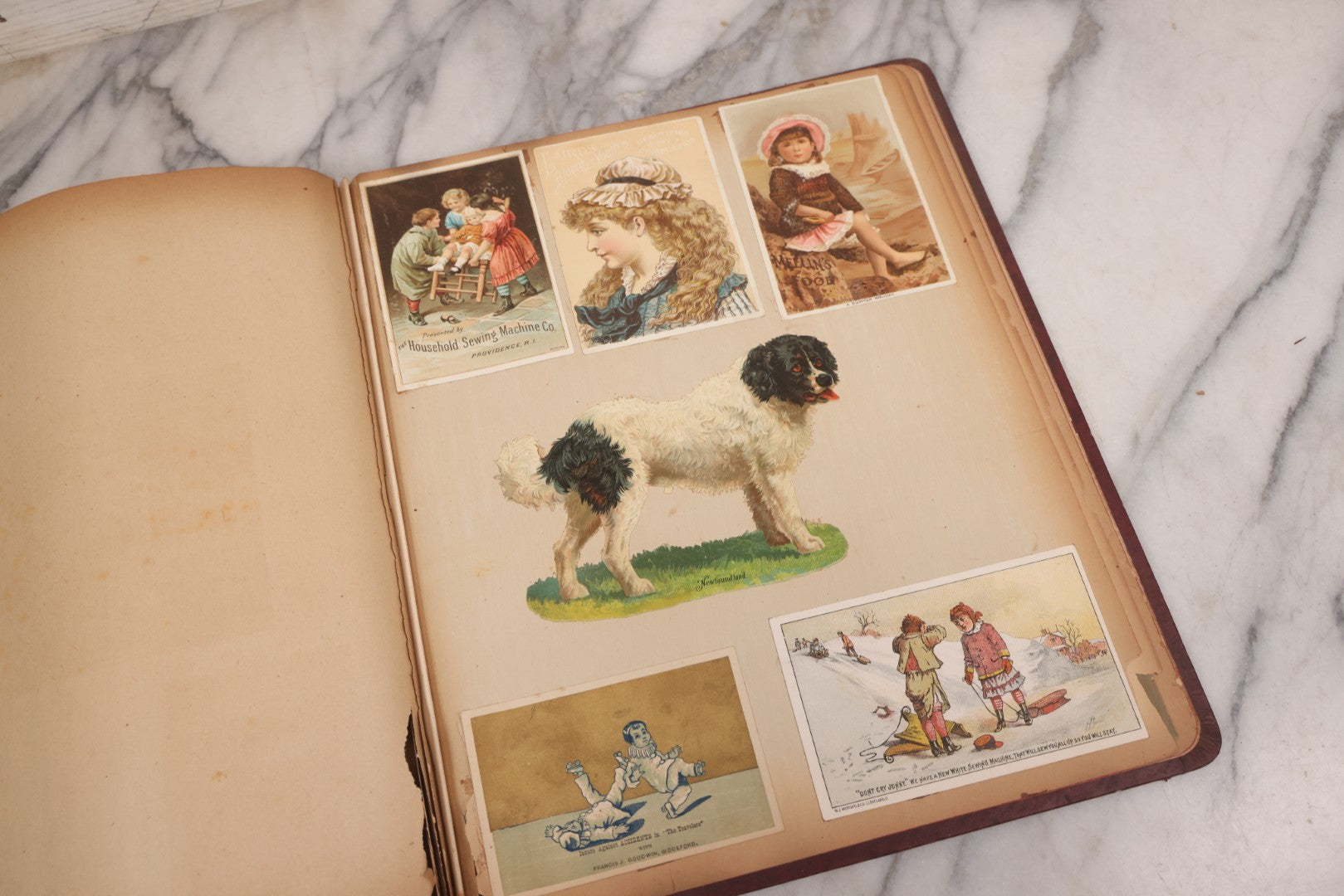 Lot 115 - Antique Victorian Scrapbook Album With Children, Flowers, Foliage On Cover Containing 50+ Pieces Including Trade Cards, Die Cuts, Calling Cards, And Other Scraps