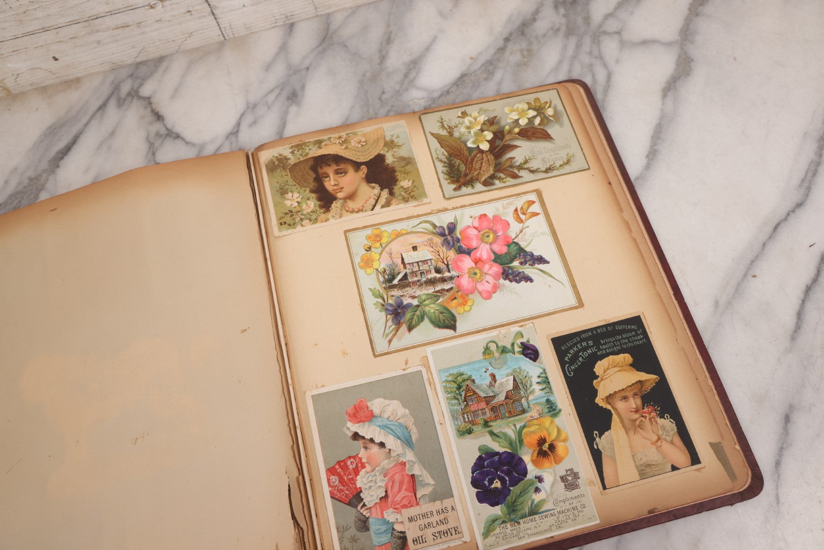 Lot 115 - Antique Victorian Scrapbook Album With Children, Flowers, Foliage On Cover Containing 50+ Pieces Including Trade Cards, Die Cuts, Calling Cards, And Other Scraps