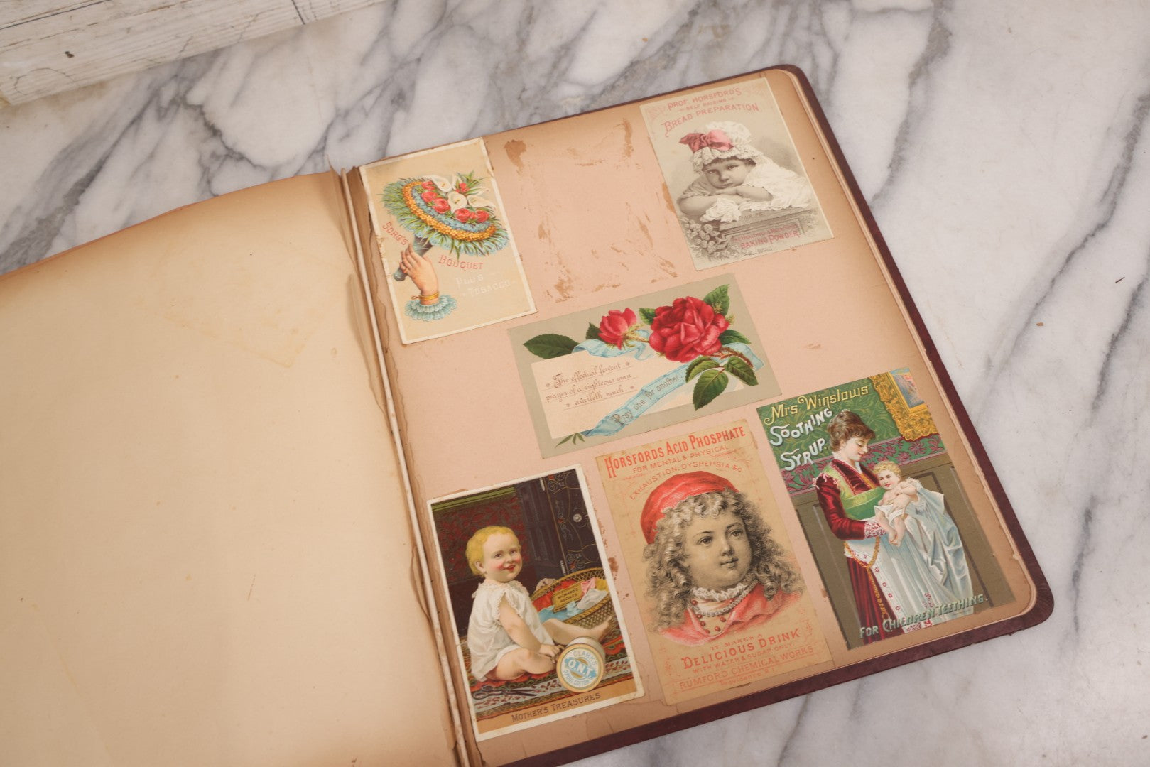 Lot 115 - Antique Victorian Scrapbook Album With Children, Flowers, Foliage On Cover Containing 50+ Pieces Including Trade Cards, Die Cuts, Calling Cards, And Other Scraps