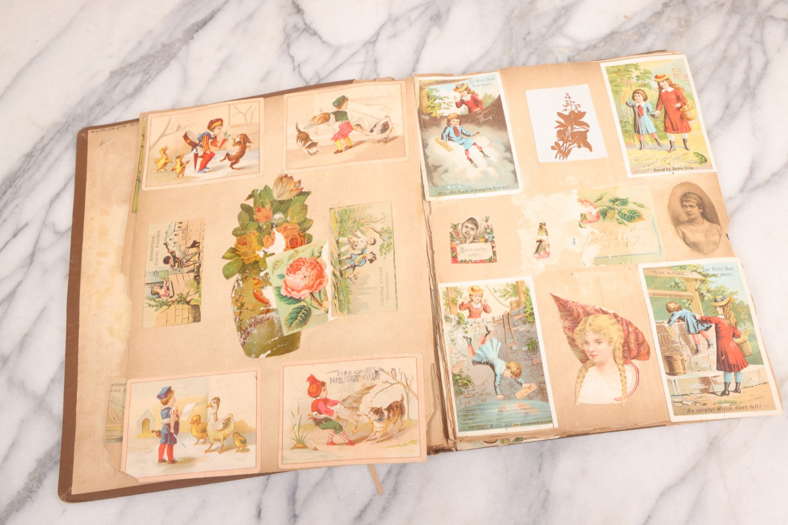 Lot 116 - Antique Victorian Scrapbook Album With Cat, Other Designs On Cover Containing 100+ Pieces Including Trade Cards, Die Cuts, Calling Cards, And Other Scraps