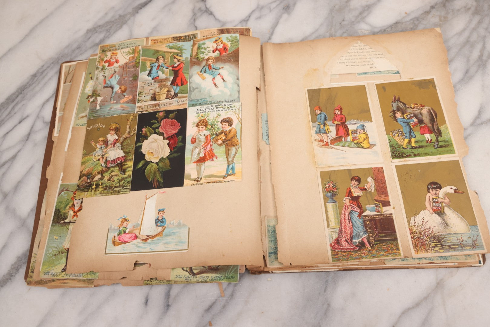 Lot 116 - Antique Victorian Scrapbook Album With Cat, Other Designs On Cover Containing 100+ Pieces Including Trade Cards, Die Cuts, Calling Cards, And Other Scraps