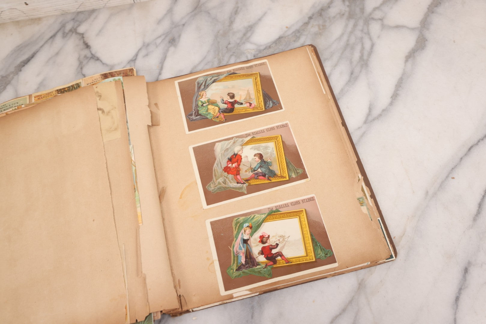 Lot 116 - Antique Victorian Scrapbook Album With Cat, Other Designs On Cover Containing 100+ Pieces Including Trade Cards, Die Cuts, Calling Cards, And Other Scraps