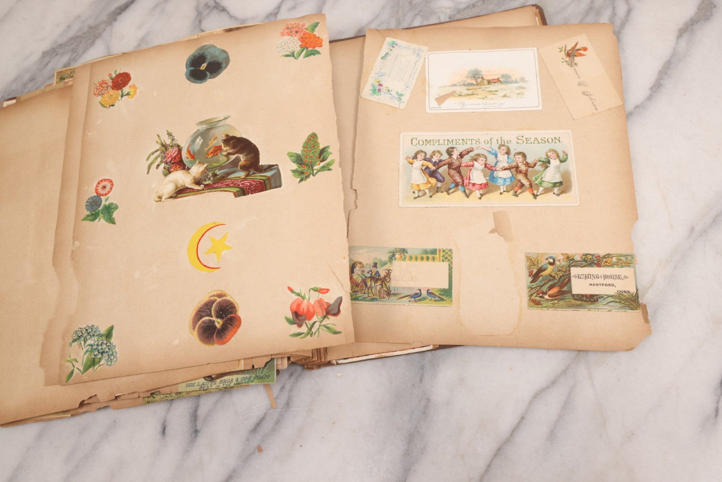 Lot 116 - Antique Victorian Scrapbook Album With Cat, Other Designs On Cover Containing 100+ Pieces Including Trade Cards, Die Cuts, Calling Cards, And Other Scraps