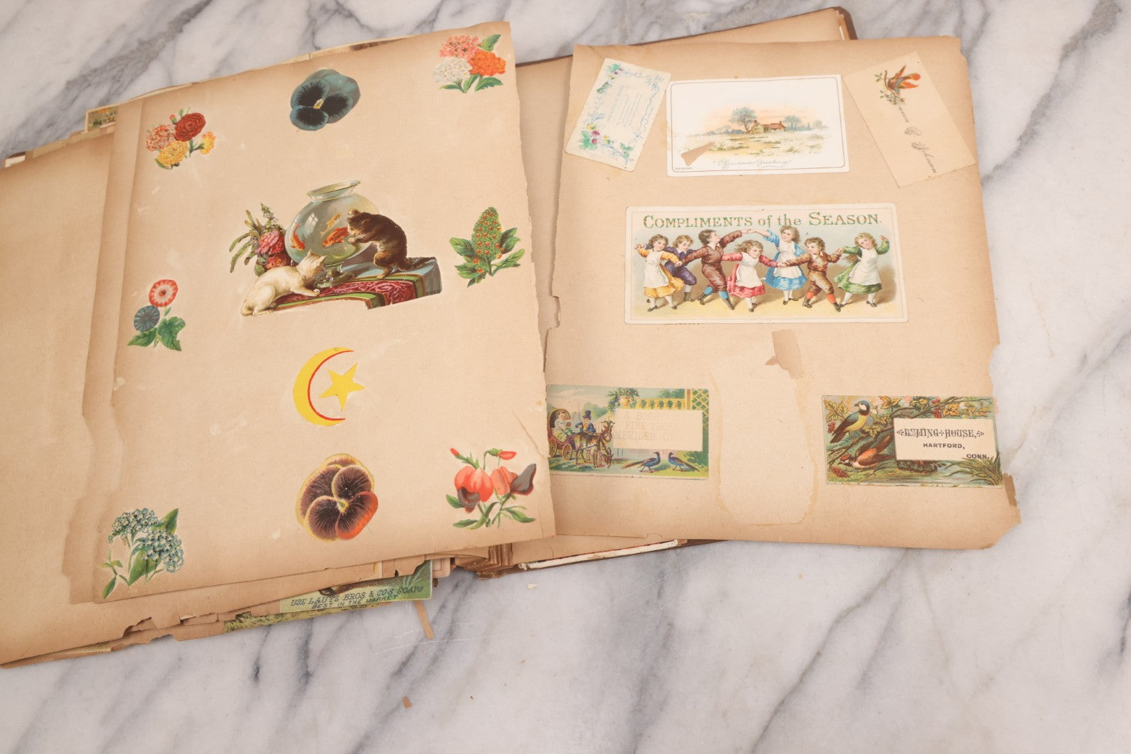 Lot 116 - Antique Victorian Scrapbook Album With Cat, Other Designs On Cover Containing 100+ Pieces Including Trade Cards, Die Cuts, Calling Cards, And Other Scraps