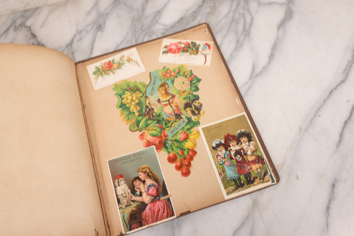 Lot 116 - Antique Victorian Scrapbook Album With Cat, Other Designs On Cover Containing 100+ Pieces Including Trade Cards, Die Cuts, Calling Cards, And Other Scraps