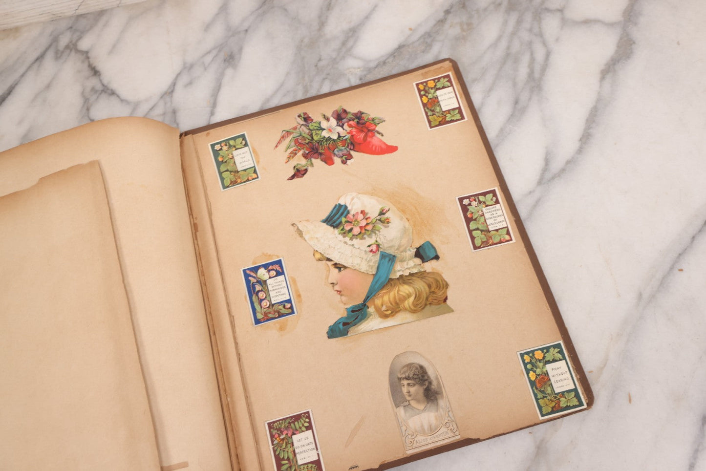 Lot 116 - Antique Victorian Scrapbook Album With Cat, Other Designs On Cover Containing 100+ Pieces Including Trade Cards, Die Cuts, Calling Cards, And Other Scraps