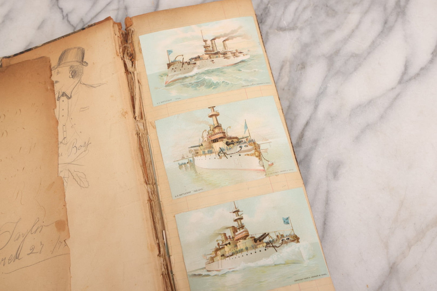 Lot 118 - Antique Scrapbook Album Made From An Old Cash Book Ledger Containing 15 Lithographed Card Featuring United States Battleships Of The Spanish American War Era, Cards Copyright 1898 By Koerner & Hayes, With Four Additional Cards, Doodles, Etc.