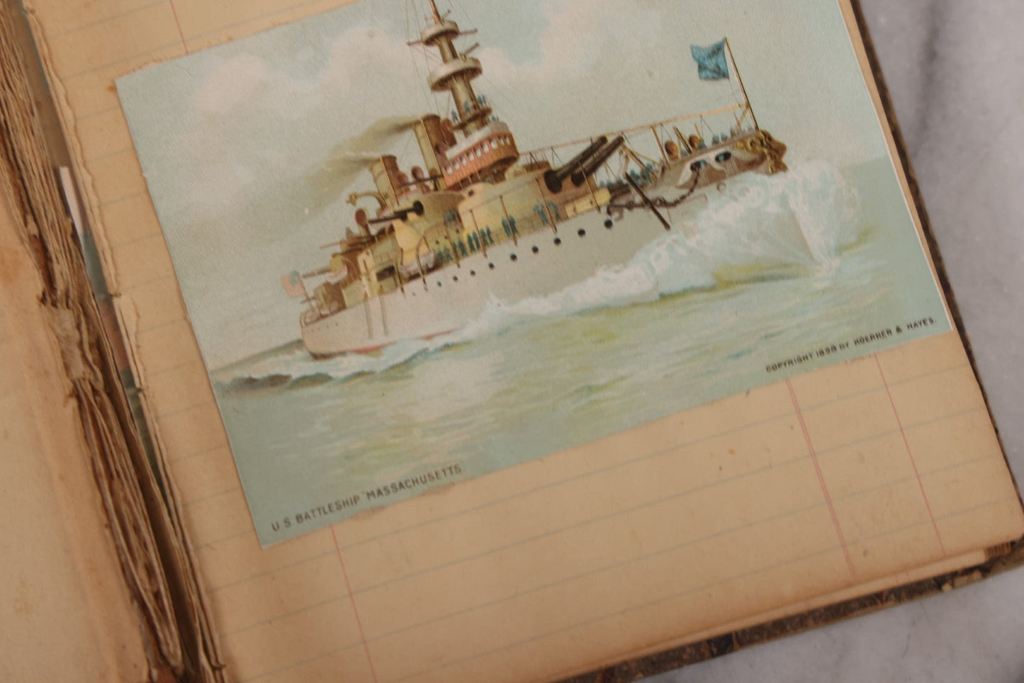Lot 118 - Antique Scrapbook Album Made From An Old Cash Book Ledger Containing 15 Lithographed Card Featuring United States Battleships Of The Spanish American War Era, Cards Copyright 1898 By Koerner & Hayes, With Four Additional Cards, Doodles, Etc.