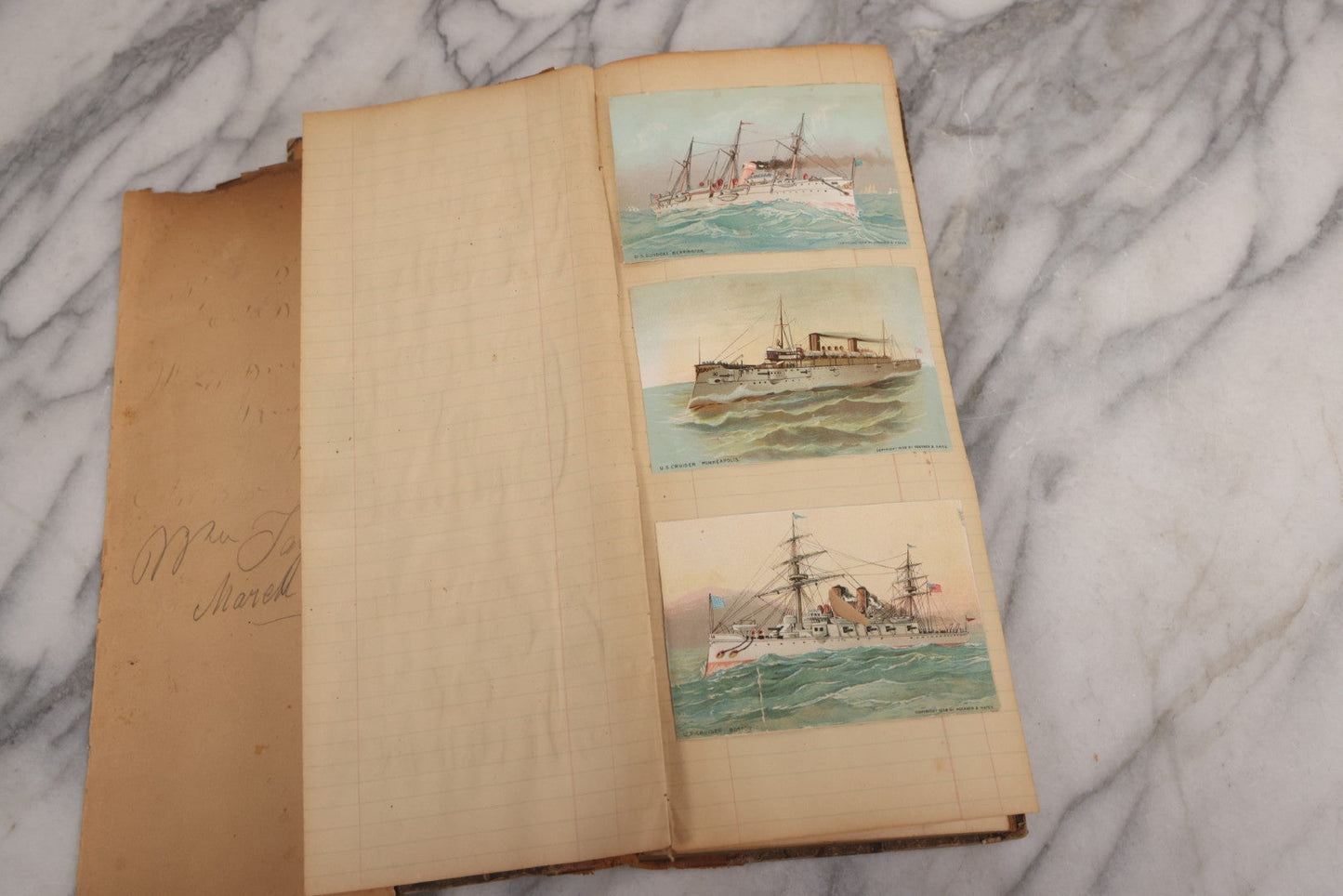 Lot 118 - Antique Scrapbook Album Made From An Old Cash Book Ledger Containing 15 Lithographed Card Featuring United States Battleships Of The Spanish American War Era, Cards Copyright 1898 By Koerner & Hayes, With Four Additional Cards, Doodles, Etc.