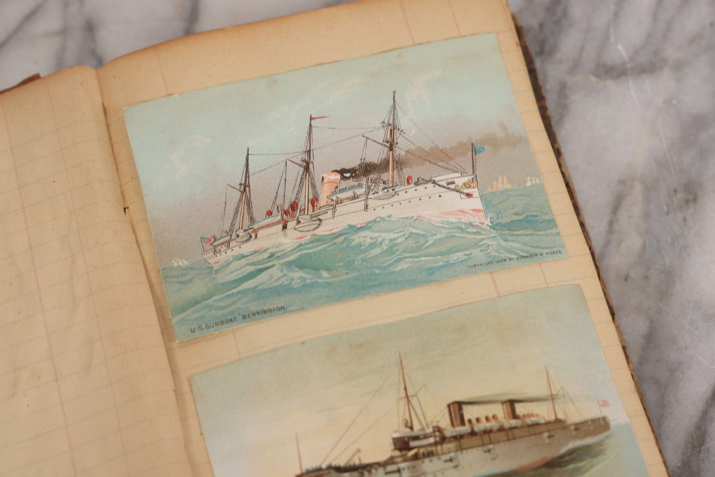 Lot 118 - Antique Scrapbook Album Made From An Old Cash Book Ledger Containing 15 Lithographed Card Featuring United States Battleships Of The Spanish American War Era, Cards Copyright 1898 By Koerner & Hayes, With Four Additional Cards, Doodles, Etc.