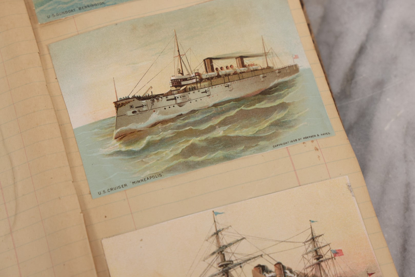 Lot 118 - Antique Scrapbook Album Made From An Old Cash Book Ledger Containing 15 Lithographed Card Featuring United States Battleships Of The Spanish American War Era, Cards Copyright 1898 By Koerner & Hayes, With Four Additional Cards, Doodles, Etc.