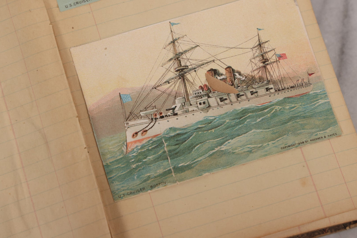 Lot 118 - Antique Scrapbook Album Made From An Old Cash Book Ledger Containing 15 Lithographed Card Featuring United States Battleships Of The Spanish American War Era, Cards Copyright 1898 By Koerner & Hayes, With Four Additional Cards, Doodles, Etc.