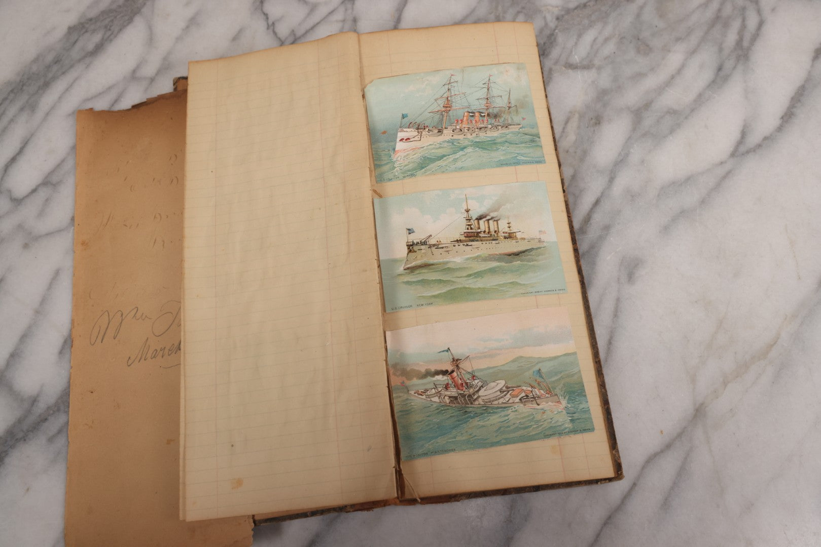 Lot 118 - Antique Scrapbook Album Made From An Old Cash Book Ledger Containing 15 Lithographed Card Featuring United States Battleships Of The Spanish American War Era, Cards Copyright 1898 By Koerner & Hayes, With Four Additional Cards, Doodles, Etc.