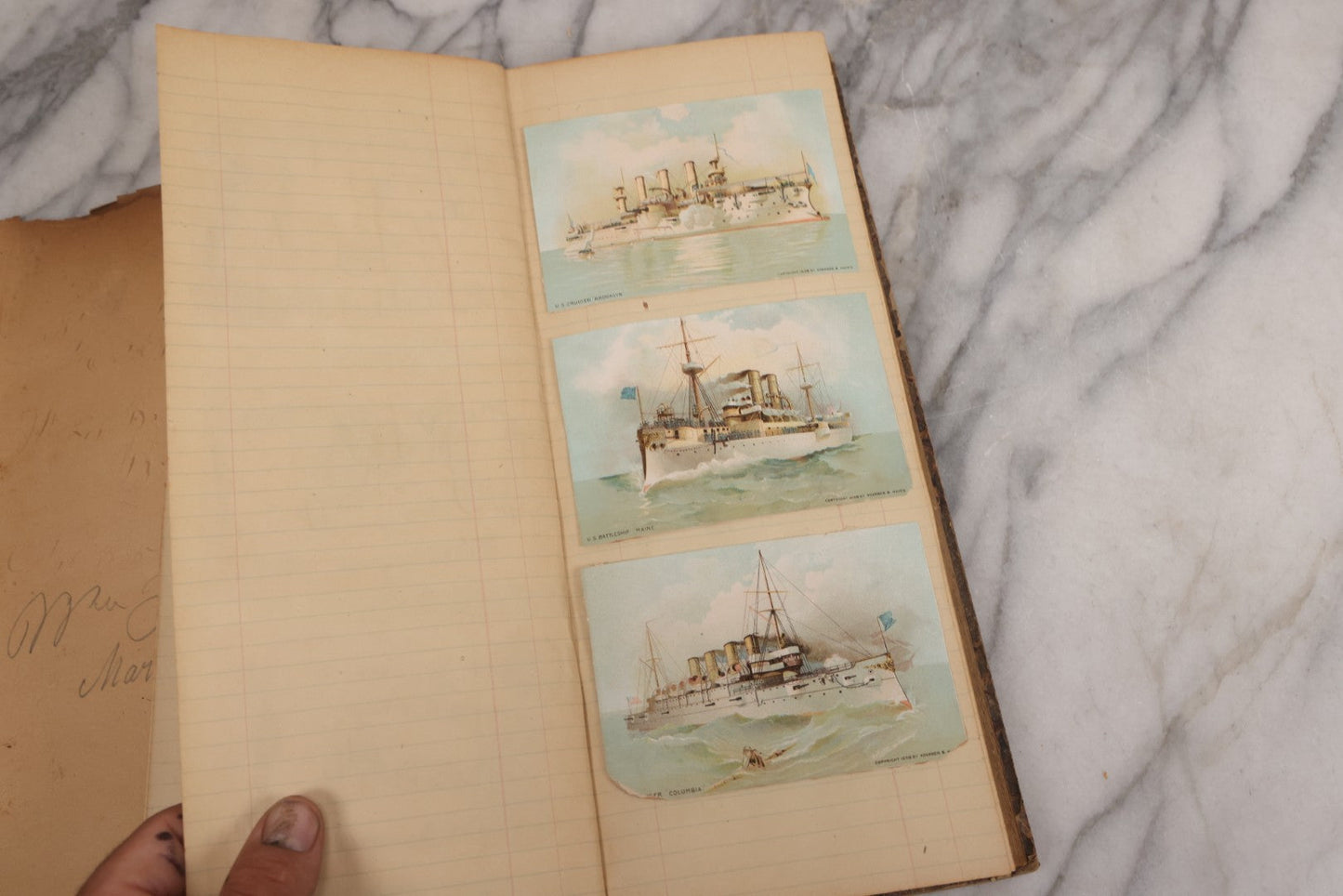 Lot 118 - Antique Scrapbook Album Made From An Old Cash Book Ledger Containing 15 Lithographed Card Featuring United States Battleships Of The Spanish American War Era, Cards Copyright 1898 By Koerner & Hayes, With Four Additional Cards, Doodles, Etc.