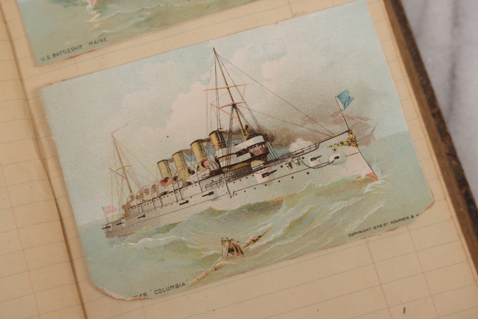 Lot 118 - Antique Scrapbook Album Made From An Old Cash Book Ledger Containing 15 Lithographed Card Featuring United States Battleships Of The Spanish American War Era, Cards Copyright 1898 By Koerner & Hayes, With Four Additional Cards, Doodles, Etc.