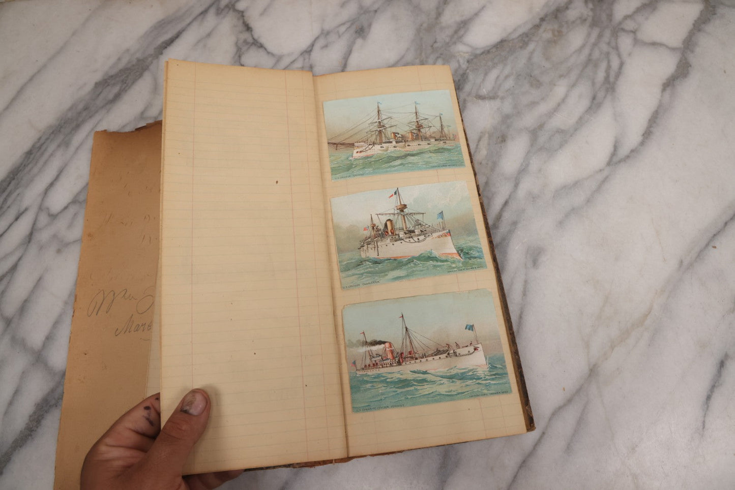 Lot 118 - Antique Scrapbook Album Made From An Old Cash Book Ledger Containing 15 Lithographed Card Featuring United States Battleships Of The Spanish American War Era, Cards Copyright 1898 By Koerner & Hayes, With Four Additional Cards, Doodles, Etc.