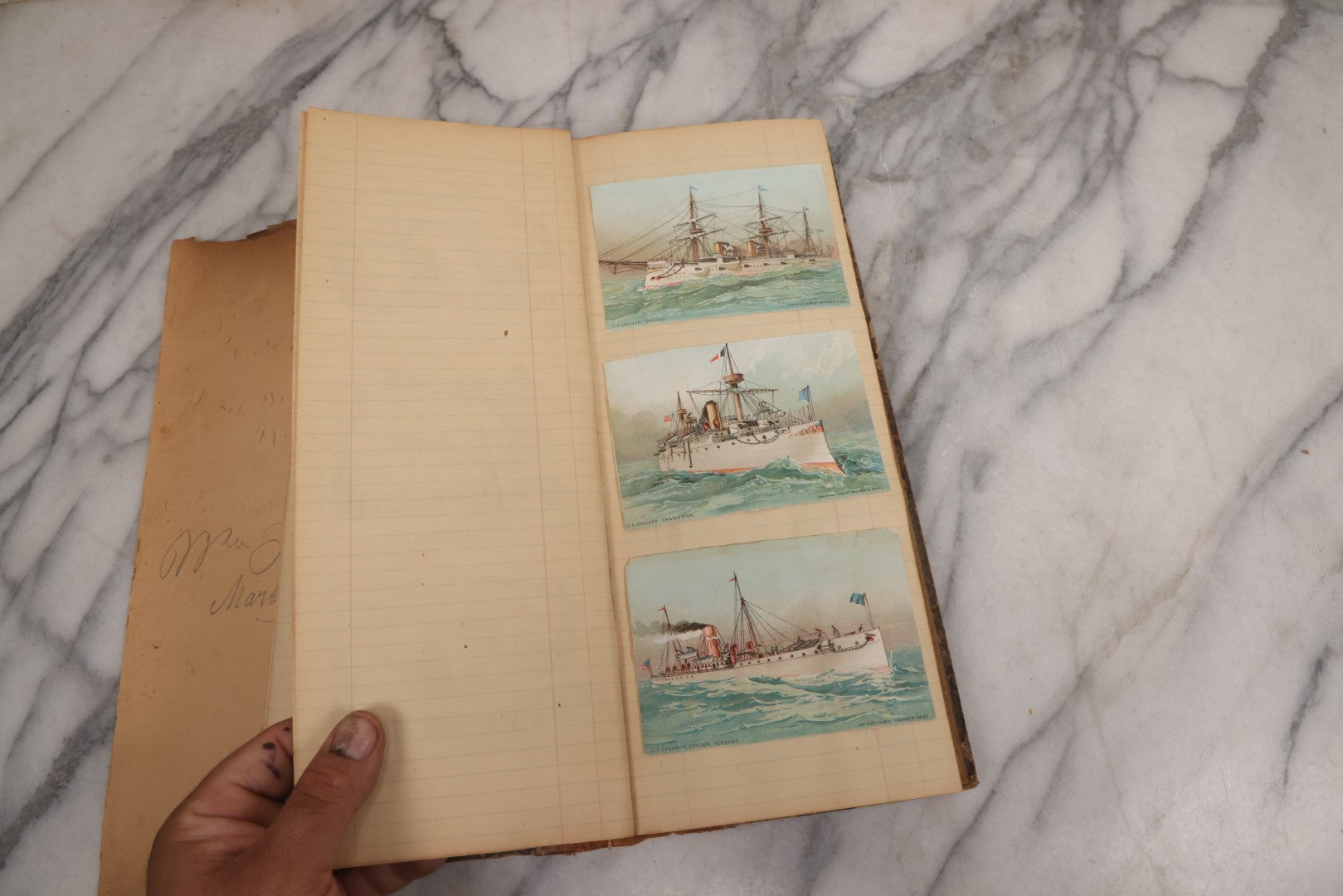 Lot 118 - Antique Scrapbook Album Made From An Old Cash Book Ledger Containing 15 Lithographed Card Featuring United States Battleships Of The Spanish American War Era, Cards Copyright 1898 By Koerner & Hayes, With Four Additional Cards, Doodles, Etc.
