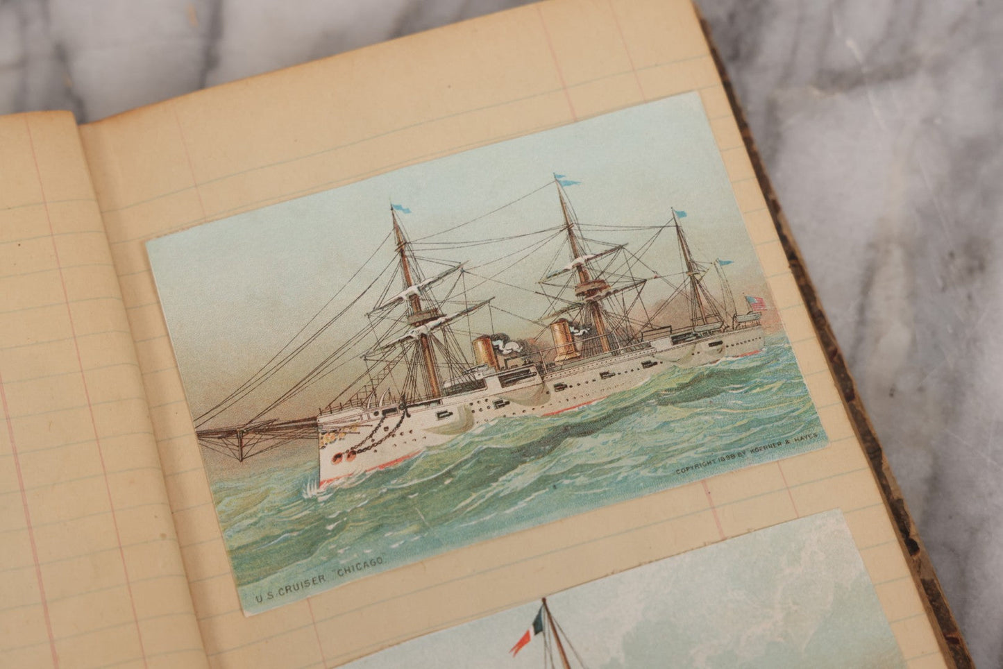 Lot 118 - Antique Scrapbook Album Made From An Old Cash Book Ledger Containing 15 Lithographed Card Featuring United States Battleships Of The Spanish American War Era, Cards Copyright 1898 By Koerner & Hayes, With Four Additional Cards, Doodles, Etc.
