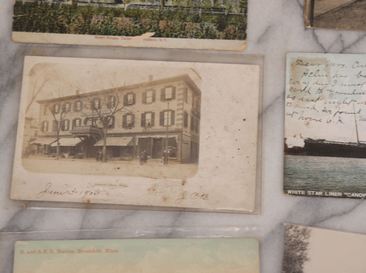 Lot 125 - Grouping Of Thirteen Mixed Miscellaneous Postcards Including R.P.P.C. Of Logging Train, Scenes From Wisconsin, White Star Liner "Canopic," Francis Willey & Co. Mill, Massachusetts, And More