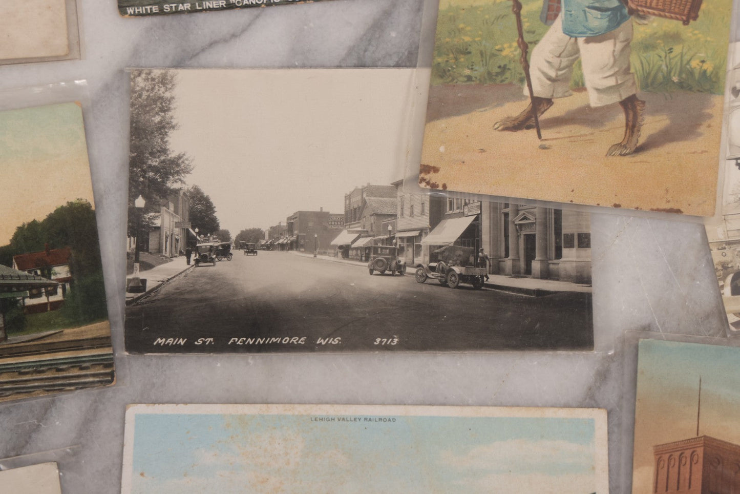 Lot 125 - Grouping Of Thirteen Mixed Miscellaneous Postcards Including R.P.P.C. Of Logging Train, Scenes From Wisconsin, White Star Liner "Canopic," Francis Willey & Co. Mill, Massachusetts, And More