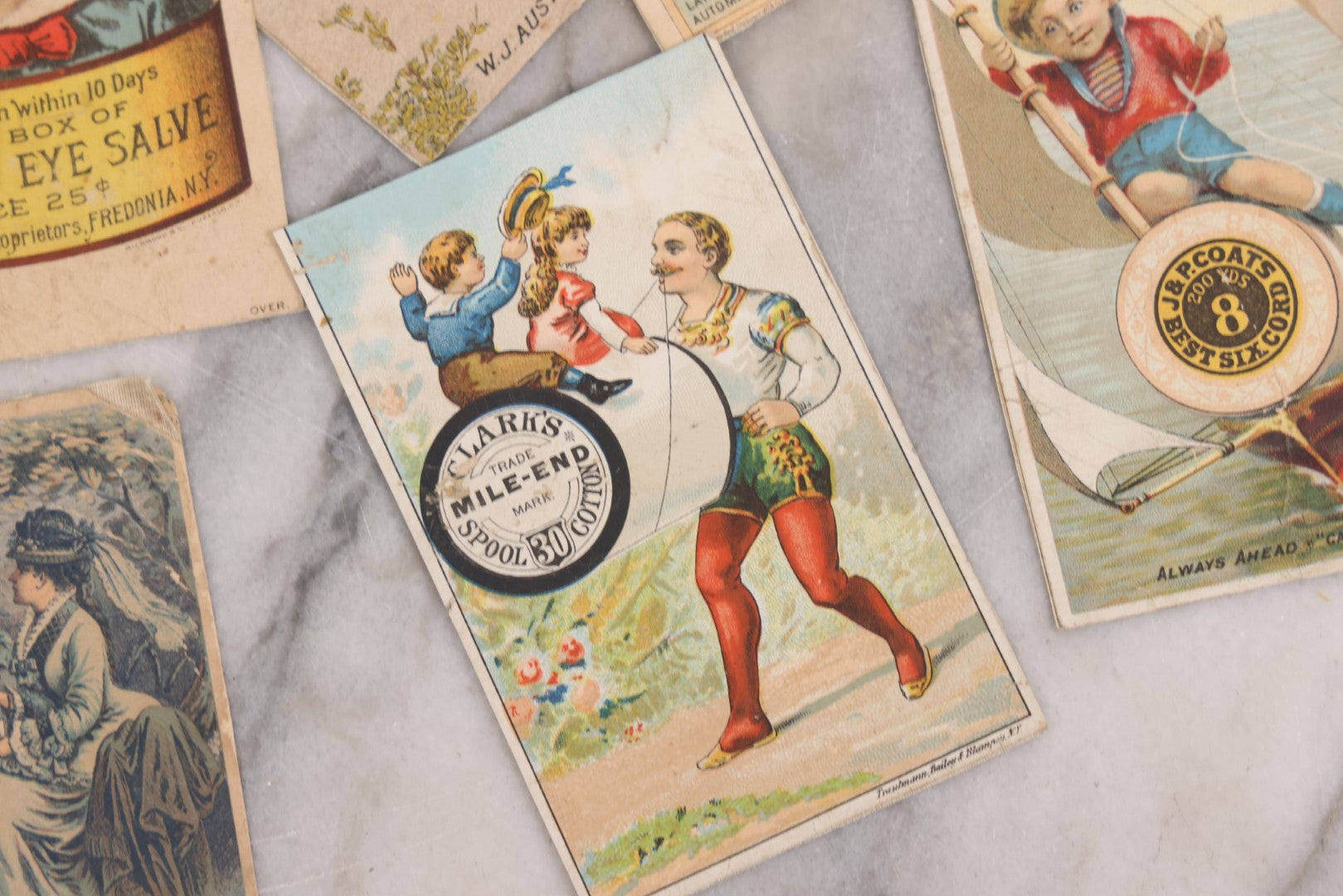 Lot 131 - Grouping Of Fifteen Antique Lithographed Trade Cards Cut From Scrap Albums, Including Petit's Eye Salve, Others, Note All Have Paper Pasted To Backs