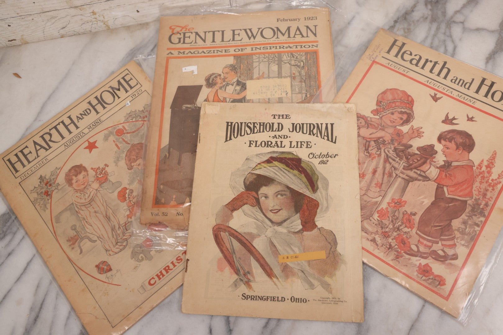 Lot 139 - Grouping Of Four Antique Illustrated Newspaper Journals, Including Hearth And Home (Christmas Issue December 1929 And August 1931), The Gentlewoman (February 1923), The Household Journal And Floral Life (October 1912)