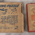Lot 146 - Pair Of Vintage Miniature Puzzle Games Including "Kreuzer Brecher - The Cross Puzzle" And "The Flying Puzzle" By Standard Trailer Co., Cambridge Springs, Pennsylvania, Note Both Appear To Be Incomplete