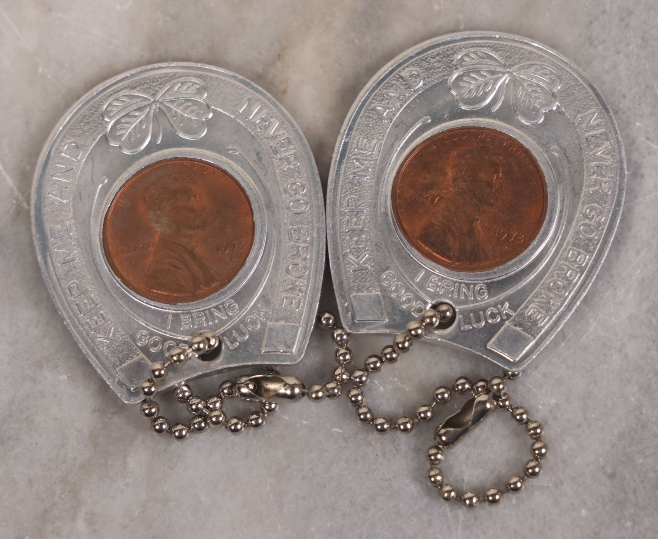 Lot 152 - Vintage Grouping Of Four  Souvenir Coin Dogtags, "Keep Me And Never Go Broke" Penny Souvenir, Shell's Coin Game Souvenir Coin, And Heart Locket Expanding Bracelet