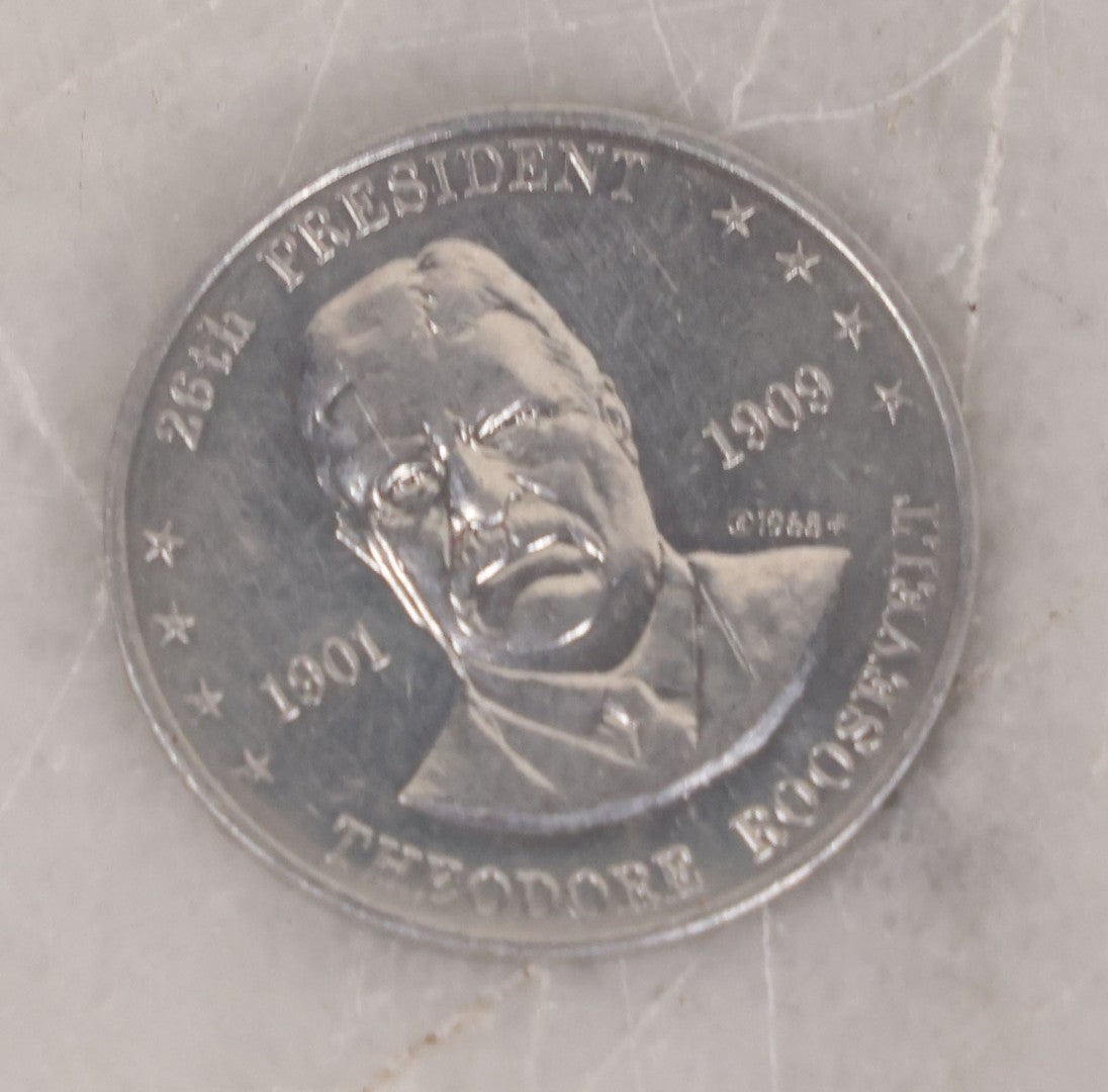 Lot 152 - Vintage Grouping Of Four  Souvenir Coin Dogtags, "Keep Me And Never Go Broke" Penny Souvenir, Shell's Coin Game Souvenir Coin, And Heart Locket Expanding Bracelet