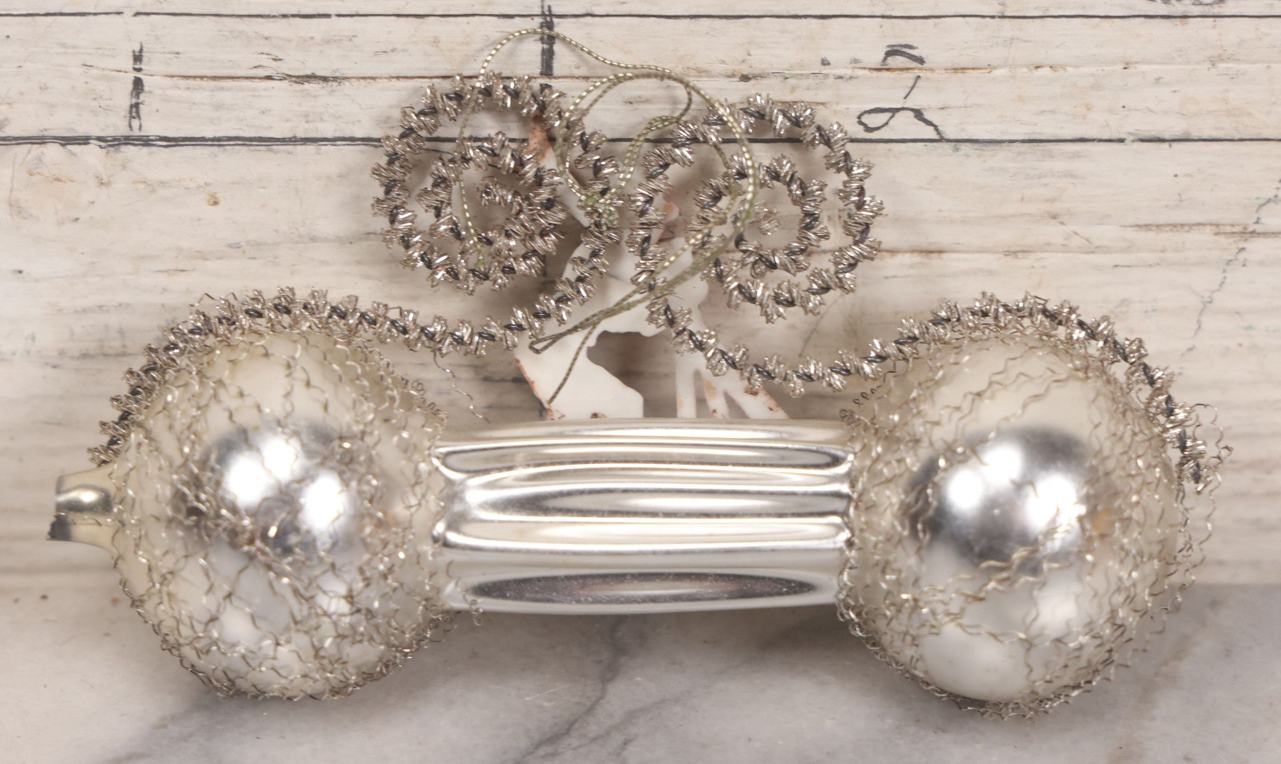 Lot 155 - Vintage Tinsel And Tin And Wire Christmas Ornament Featuring Plastic Skier Holding Skis And Ski Poles With Red Gloves, Barbell Shape, 4-3/4" Length