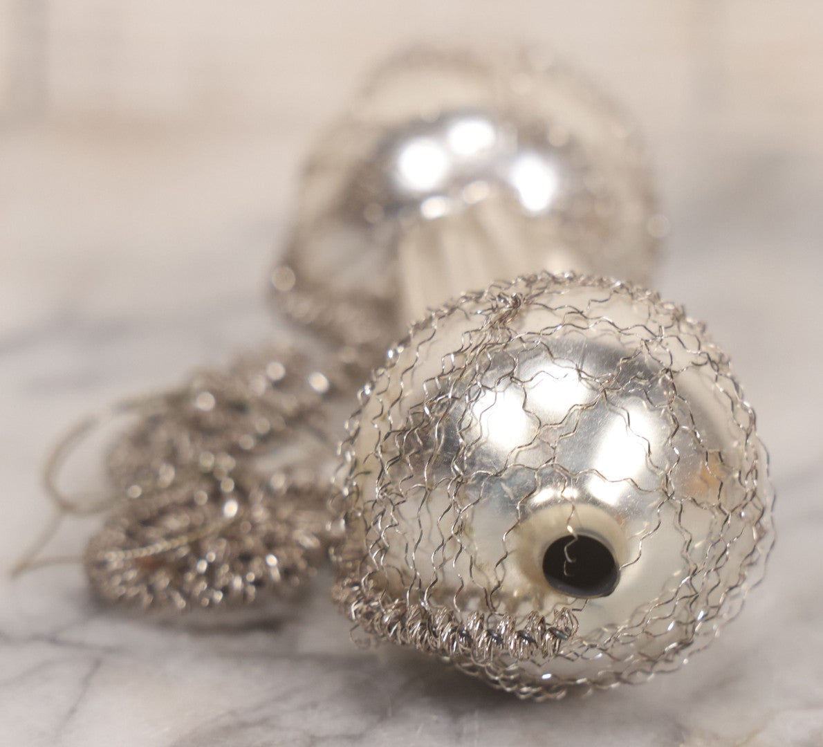 Lot 155 - Vintage Tinsel And Tin And Wire Christmas Ornament Featuring Plastic Skier Holding Skis And Ski Poles With Red Gloves, Barbell Shape, 4-3/4" Length